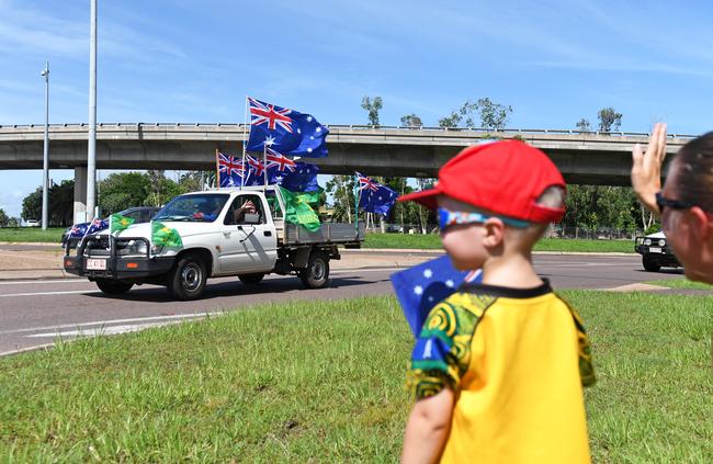 Kiam Hardman, 2, watches on as a ute rounds the corner at the Ludmilla flyover as part of the ute run. Picture: Che Chorley