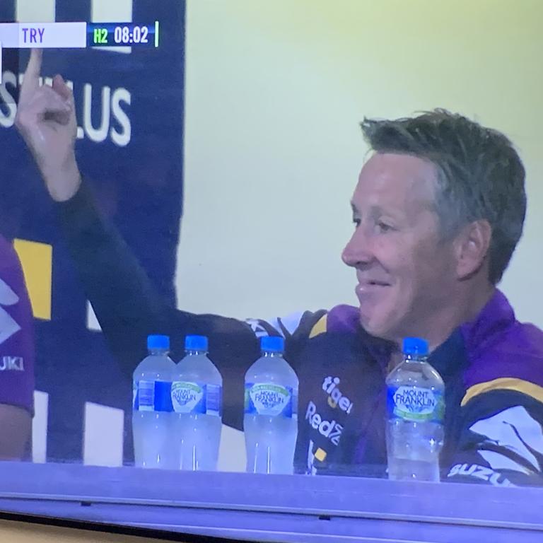 Storm coach Craig Bellamy gives Cameron Smith the bird after the skipper went past his coach for career tally of tries scored.