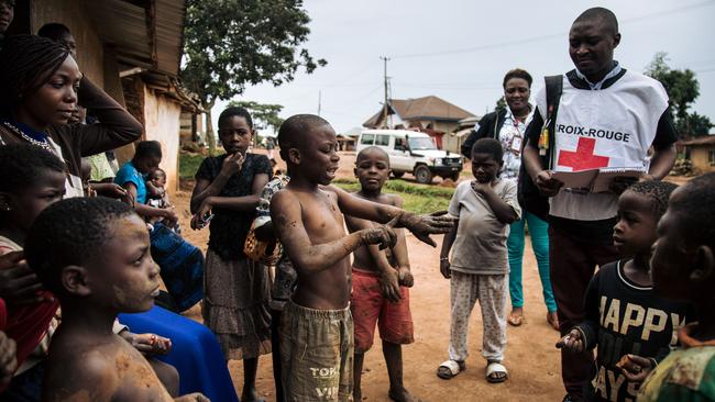 Health workers go door-to-door in the Beni neighbourhoods, northeastern Democratic Republic of Congo, to listen to families about their fear of the Ebola virus. Picture: Alexis Huguet/AFP