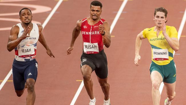 TOKYO, JAPAN - JULY 31: Rohan Browning of Australia winning heat seven of the 100m preliminary round for men from Chijindu Utah of Great Britain and Kojo Musah of Denmark during the Athletics competition at the Olympic Stadium at the Tokyo 2020 Summer Olympic Games on July 31, 2021 in Tokyo, Japan. (Photo by Tim Clayton/Corbis via Getty Images)