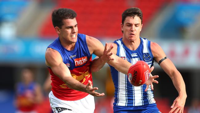 Lions defender Brandon Starcevich (left) battles with North Melbourne’s Luke Davies-Uniacke. Picture: Chris Hyde/Getty Images