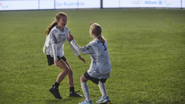 Children celebrate a goal to the sounds of cheering fans and sporting legends as part of the initiative Picture: Supplied