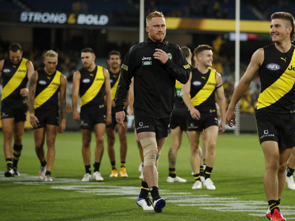 Nick Vlastuin leaves the field with a leg injury after the win. Picture: Dylan Burns/AFL Photos via Getty Images