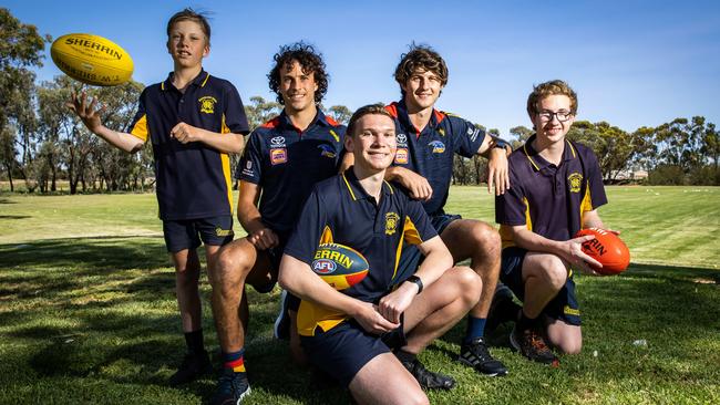 Crows players Will Hamill and Jordan Butts with students Declan Bonner, 12, Lachlan Goody, 17, and Alex Teakle, 17, at Renmark High. Picture: Tom Huntley