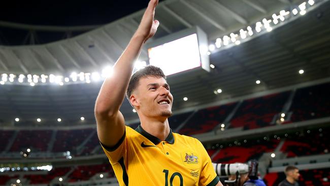 DOHA, QATAR - JUNE 07: Ajdin Hrustic of Australia celebrates after their sides victory during the 2022 FIFA World Cup Playoff match between United Arab Emirates and Australia at Ahmad Bin Ali Stadium on June 07, 2022 in Doha, Qatar. (Photo by Mohamed Farag/Getty Images)