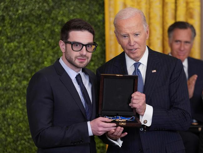 Alex Soros accepts the Medal of Freedom on behalf of his father George Soros. Picture: AFP