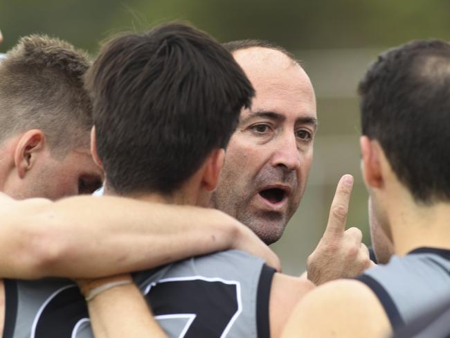 Amateur footy: Brighton v Adelaide University at Brighton Oval. University Coach Craig Smith makes a point at three quarter time. 13 April 2019. (AAP Image/Dean Martin)