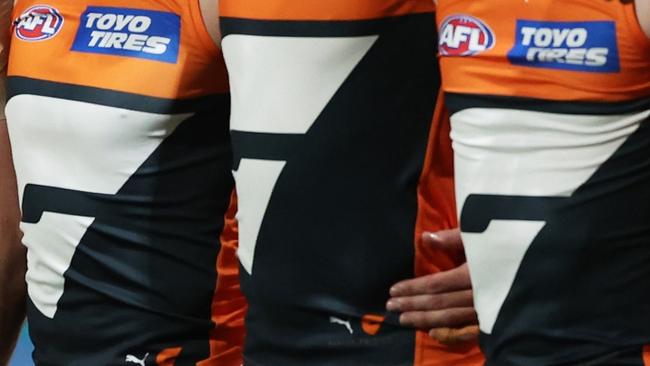 SYDNEY, AUSTRALIA - SEPTEMBER 14:  The Giants line up for the welcome to country and national anthem ceremony during the AFL First Semi Final match between GWS Giants and Brisbane Lions at ENGIE Stadium, on September 14, 2024, in Sydney, Australia. (Photo by Matt King/AFL Photos/via Getty Images)