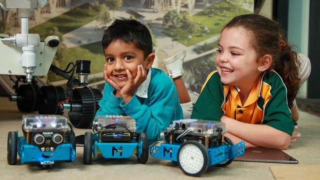 Serhan Sadiq Gandhi, 4, and Ariana Bousimon, 5, playing with robots, at the Parramatta Powerhouse Community Space. <span>Picture: Justin Lloyd</span>