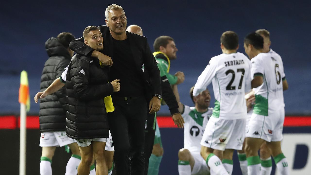 Long live mayhem: Mark Rudan and Western United celebrate their incredible last-gasp win over Melbourne Victory.