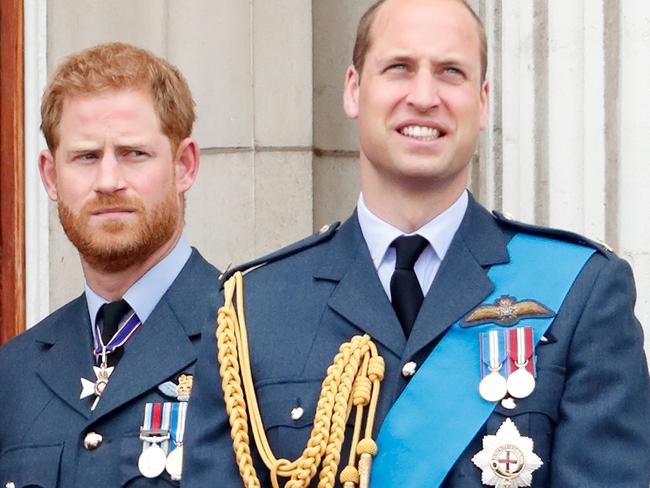 Prince Harry and Prince William watch a flypast to mark the centenary of the Royal Air Force from the balcony of Buckingham Palace. Picture: Getty Images.