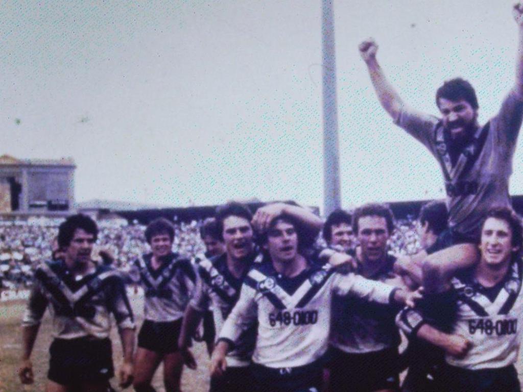 The Bulldogs 1980 ‘Entertainers’ celebrate after beating the Roosters in the 1980 NSWRFL Grand Final.