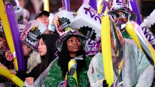 A reveller looks on as people celebrate New Year's Eve in Times Square. Picture: AFP