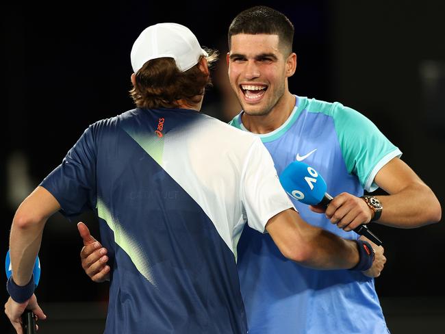 Carlos Alcaraz and Alex de Minaur embrace following their charity match. Picture: Getty Images