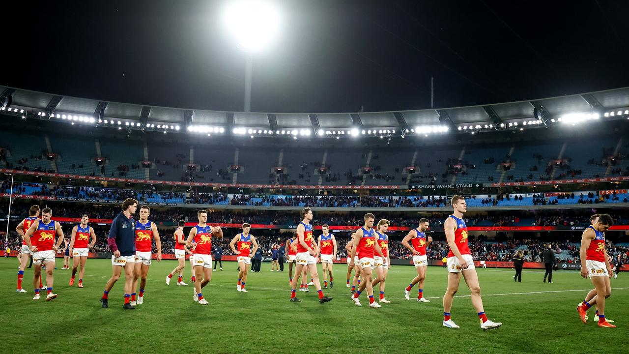 The Lions look dejected after a loss during the 2023 AFL Round 18 match between the Melbourne Demons and the Brisbane Lions. Picture: Dylan Burns/AFL Photos via Getty Images