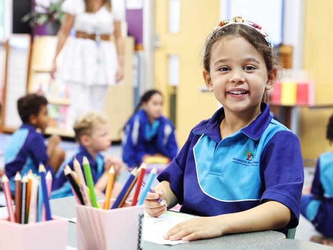 Parramatta State School prep student Ezra Booysen does some colouring in with her new class mates on the first day of school for 2025. Picture: Brendan Radke