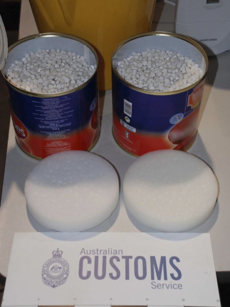 Two tins disguised as canned tomato, holding thousands of ecstasy tablets. Picture: Australian Customs Service