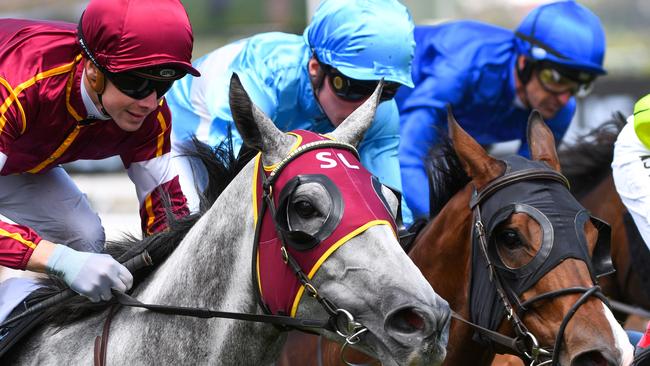 Jockey Jye McNeil rides Blazejowski to victory in race 4, the Furlong Bar Handicap, during Chester Manifold Stakes Day at Flemington Racecourse in Melbourne, Saturday, January 11, 2020. (AAP Image/Vince Caligiuri) NO ARCHIVING, EDITORIAL USE ONLY