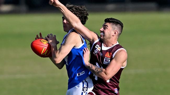 Sunbury’s Cody Bramble, who takes a strong mark against Melton, will be back at the club this year. Picture: Andy Brownbill