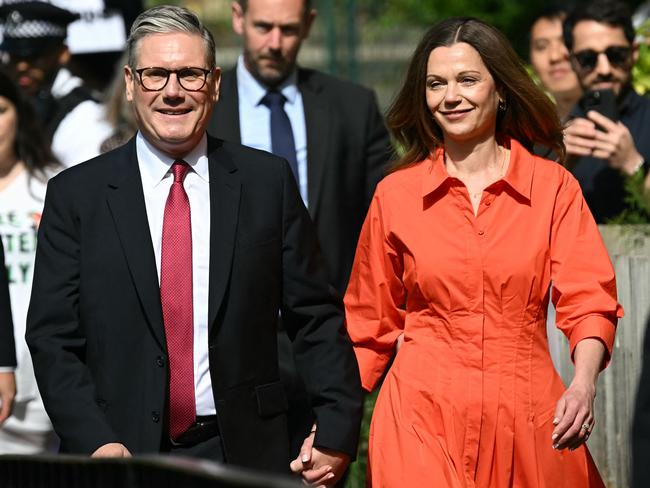 Britain's opposition Labour Party leader Keir Starmer and his wife Victoria arrive to cast their votes at a polling station in London on July 4, 2024 as Britain holds a general election. (Photo by Paul ELLIS / AFP)