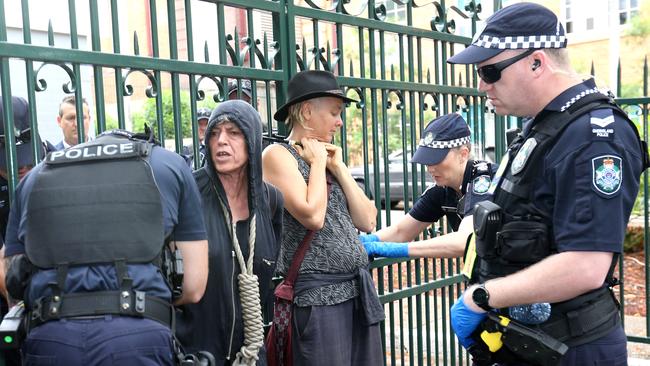 Protesters being arrested after a march and sit on the road around QLD Parliament House on Tuesday 4th February 2020. Photo: Steve Pohlner