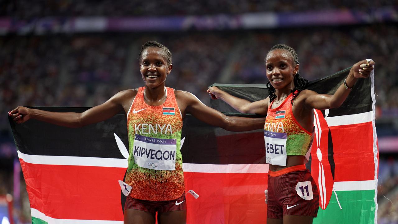 Kipyegon celebrated before the news of her DQ came to light. (Photo by Adam Pretty/Getty Images)