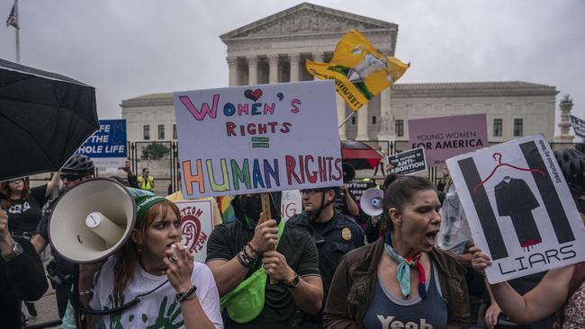 Pro-abortion activists chant during a rally in front of the Supreme Court. Picture: AFP.