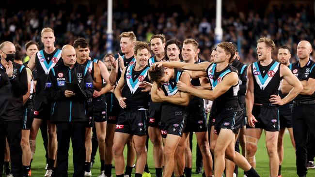 Connor Rozee is congratulated by teammates for winning the Badcoe Medal. Picture: Getty