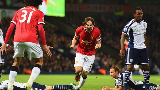 West Bromwich Albion defenders look dejected as Daley Blind celebrates.