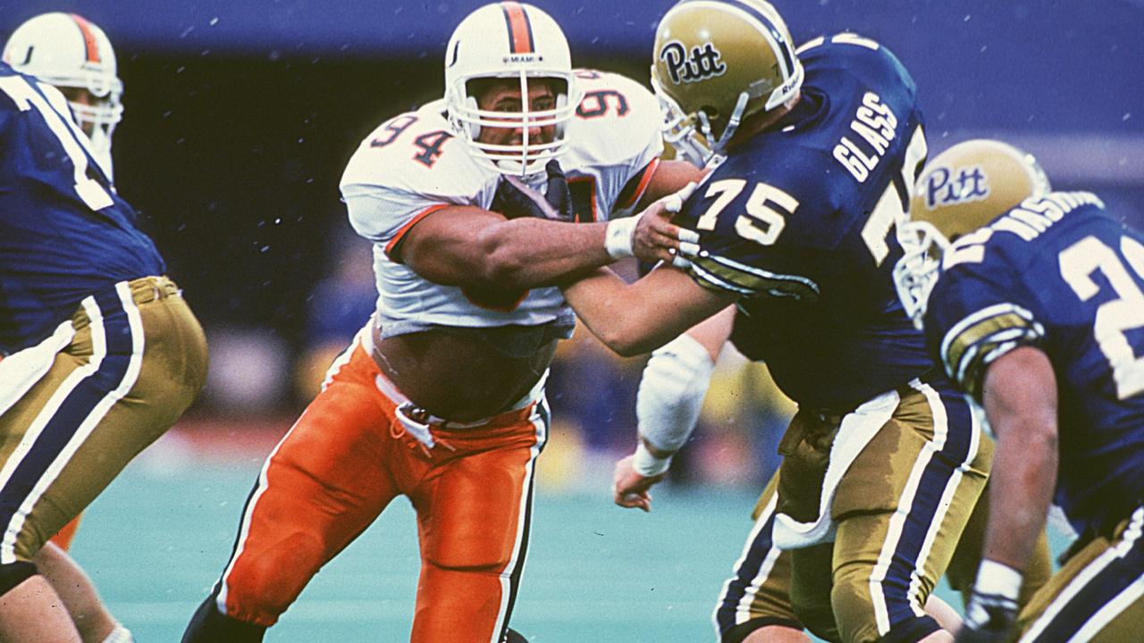 Dwayne “The Rock” Johnson (c) on the University of Miami football team. Photos by Miami/Collegiate Images/Getty Images.