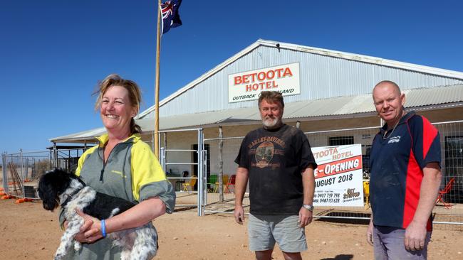 Betoota Hotel co-owners (from left) Carol Norman with dog Sonny, Brad Winpenny and Nigel Lewis (Missing from photo is co-owner Robert Haken). Pic: Bruce Long