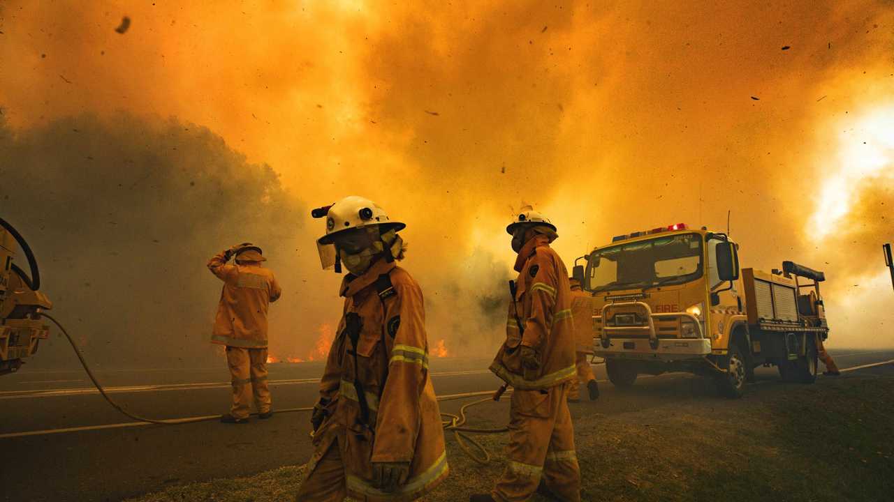 Firefighters on the scene at an out of control bushfire at Peregian Beach, where hundreds of residents were evacuated yet again. Photo Lachie Millard. Picture: Lachie Millard