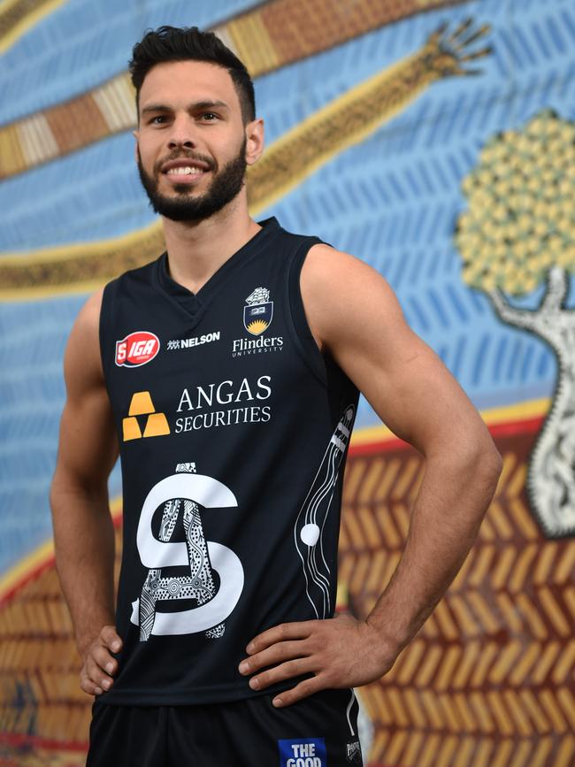 Rankine with the South Adelaide Indigenous guernsey he designed in 2015. Picture: Naomi Jellicoe