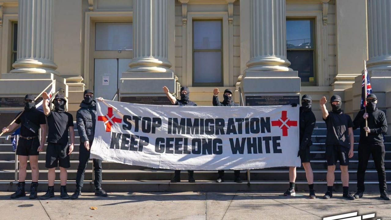 A group from the Nationalist Socialist Movement pose for a photo in front of Geelong City Hall. Photo: Supplied.