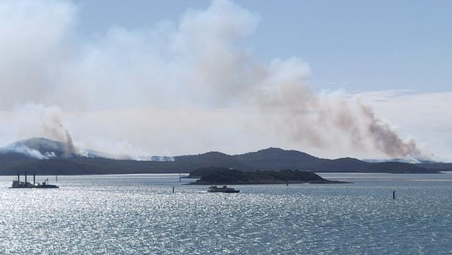 Fires off Gladstone on Curtis Island captured from Auckland Point. The burns are being conducted by the Queensland Parks and Wildlife Service for hazard reduction. Picture: Rodney Stevens