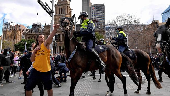 Kristian Pulkownik (yellow top) during the rally on Saturday. Picture: Steven Saphore/AFP