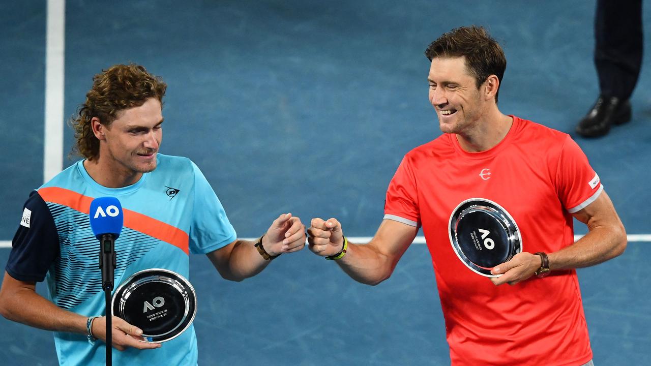 Australia's Max Purcell (L) and Australia's Matthew Ebden fist bump during the awards ceremony.