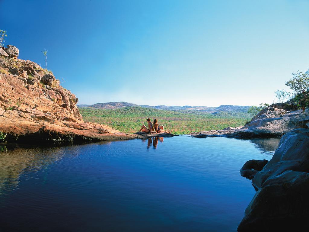 <b>GUNLOM PLUNGE POOL, KAKADU, NT:</b> Known as nature’s infinity pool, Gunlom is one of the most extraordinary spots to enjoy sweeping views over Kakadu National Park. The billabong at the base of the falls is a popular attraction and made an appearance in Crocodile Dundee. A steep climb to reach the top of the falls will get you to the less-visited, crystal clear plunge pool. Gunlom is the only escarpment waterfall in Kakadu that is accessible by 2WD vehicle during dry season, and the site has picnic and camping facilities. <a href="http://www.kakadutourism.com/" target="_blank">kakadutourism.com</a>