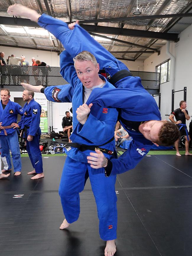 Free martial arts classes have started for veterans to help them beat mental health issues at a new centre called Veteran Grappling. Its founder Scott Steer is picturing throwing Luke Meir. Photo: Richard Gosling