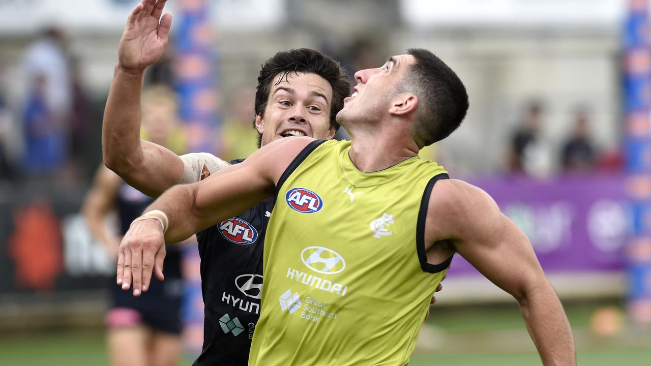 Jacob Weitering under pressure from Jack Silvagni at Carlton training on Saturday. Picture: Andrew Henshaw