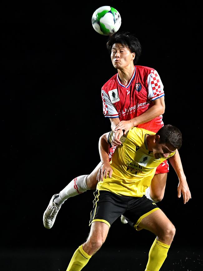 Junya Yabe of the Knights and Joshua Taylor of Edge Hill United compete for the ball during the FFA Cup round of 32 match between Edge Hill United and Gold Coast Knights at Barlow Park on September 15, 2021 in Cairns, Australia. (Photo by Albert Perez/Getty Images)