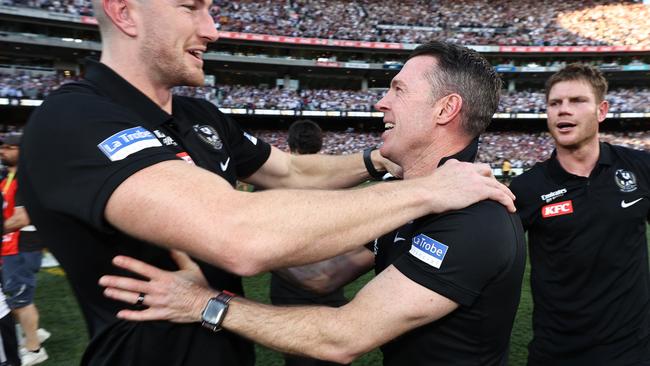 MELBOURNE , AUSTRALIA. September 30, 2023. AFL Grand Final between Collingwood and the Brisbane Lions at the MCG.  Craig Macrae, senior coach of the Magpies with Daniel McStay and Taylor Adams   .Picture by Michael Klein