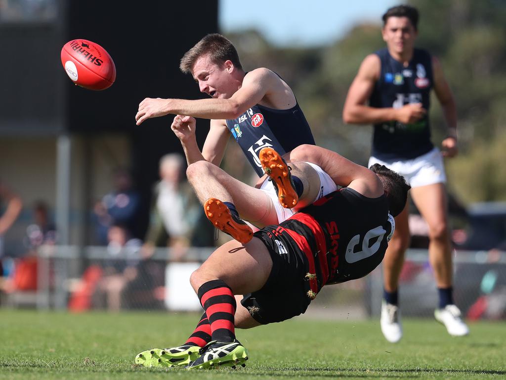 Thor Boscott of Lauderdale tackles Tyson Miller of Launceston in their TSL match at Lauderdale Oval. Picture: NIKKI DAVIS-JONES