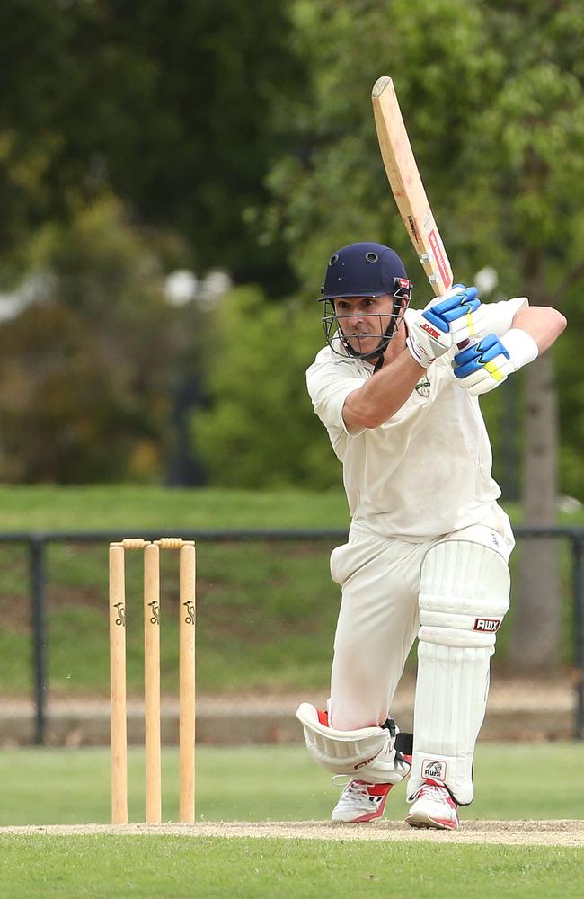 Oakleigh’s Graeme Vimpani hits through cover against Ormond.