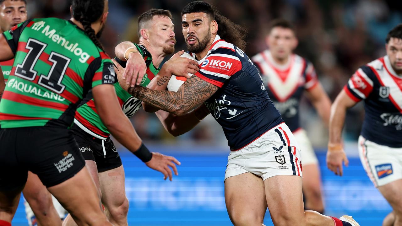 SYDNEY, AUSTRALIA - SEPTEMBER 01: Terrell May of the Roosters is tackled during the round 27 NRL match between South Sydney Rabbitohs and Sydney Roosters at Accor Stadium on September 01, 2023 in Sydney, Australia. (Photo by Matt King/Getty Images)