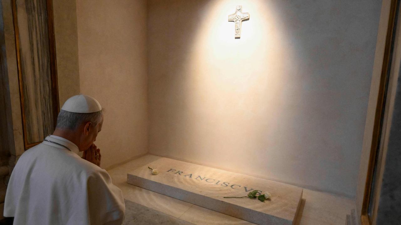 Pope Leo XIV paying his respects to late Pope Francis in front of his tomb at Santa Maria Maggiore Basilica in Rome. Picture: Vatican Media/AFP