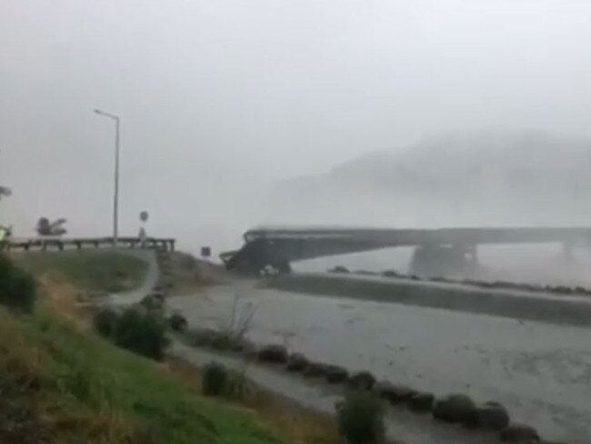 The incredible moment a bridge in New Zealand is washed away in an intense storm.
