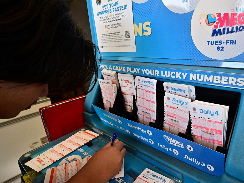 Numbers on tickets for the Mega Millions lottery are selected by a purchaser in Los Angeles, California, on August 4, 2023.