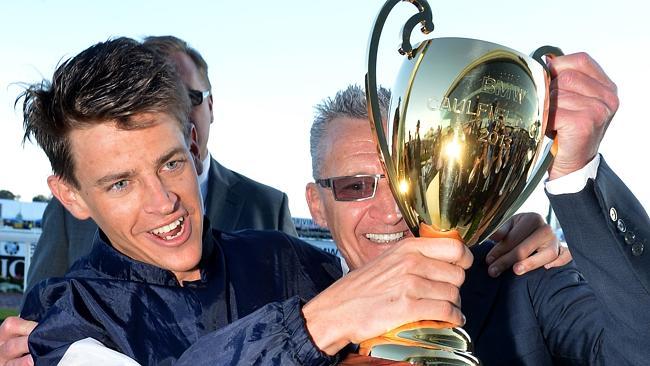 Nicholas Hall and his dad Greg celebrate Fawkner's Caulfield Cup win. 