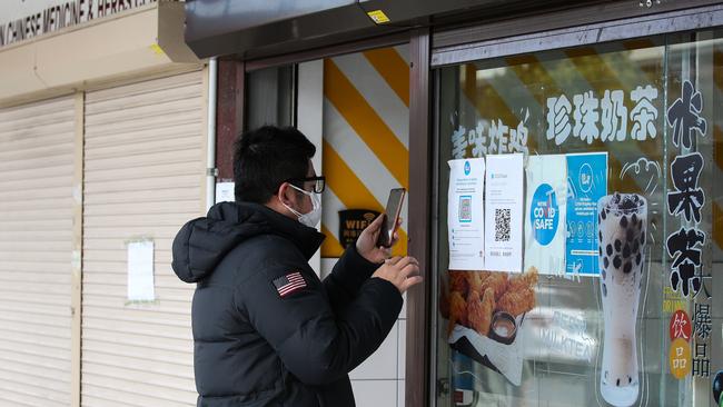 A shopper is seen wearing a protective face mask in Auburn Town Centre. Southwest Sydney LGA areas remain under tight lockdown restrictions as the Covid-19 case numbers continue to rise in Sydney. Picture: NCA NewsWire/ Gaye Gerard